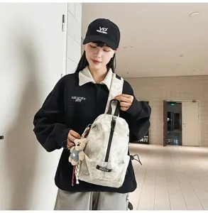 Stylish tie-dye chest bag for outdoor cycling featuring a cute plush bear pendant accessory
