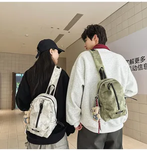 Back view of models wearing casual green and grey tie-dye chest bags in a modern interior