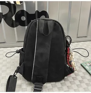 Back view of a black casual chest bag with adjustable wide shoulder strap