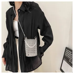 Close-up of a stylish transparent beaded crossbody phone bag for fashion-conscious women