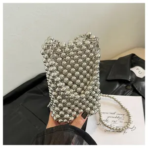 Detailed view of handcrafted silver beaded mobile phone bag with shoulder strap