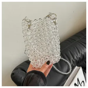 Detailed view showing the intricate texture of clear beaded handmade crossbody phone bag