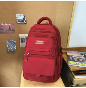 Sac à dos scolaire rouge grande capacité pour étudiants avec compartiments multiples