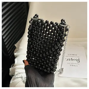 Close-up of black beaded woven mini phone bag with silver chain strap