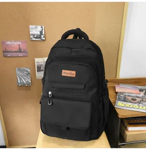 Sac à dos d'écolier noir minimaliste de grande capacité au style japonais épuré