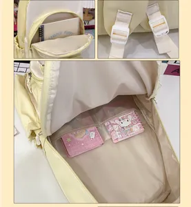 Interior storage view and strap details of yellow color-block college student backpack