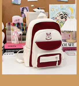 Cute white and maroon color-block large capacity student backpack displayed on a study desk.