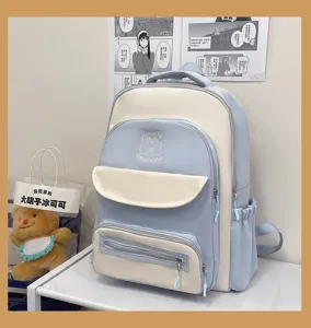 Detailed front view of a cute light blue and white color-blocked academy style schoolbag