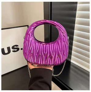 Metallic purple pleated acrylic handbag featuring a circular handle and silver chain strap