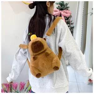 Cute brown capybara plush backpack worn by a person, showing soft texture and scale