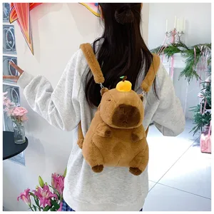 Cute plush capybara backpack shown on model with soft fur and orange decoration