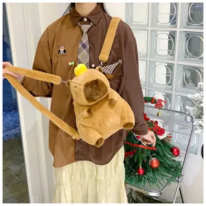 Close-up of a cute plush capybara shoulder bag with a yellow fruit decoration on top.