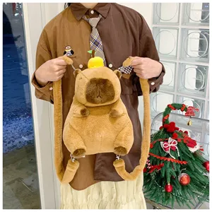 Model showcasing the cute cartoon plush capybara backpack in a cozy indoor setting