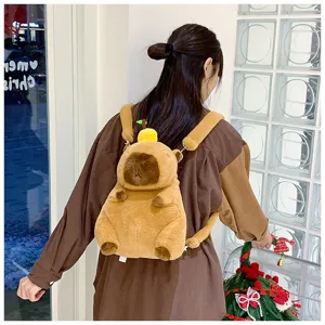 Back view of a cute plush capybara backpack with fruit ornament worn by a young girl