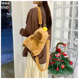 Detailed view of a soft brown capybara plush backpack with a cute orange accessory for children