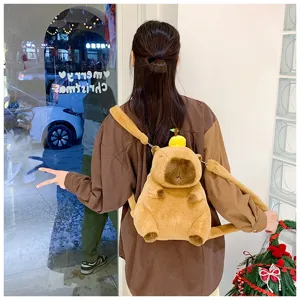 Back view of a person wearing a cute brown plush capybara backpack with a fruit decoration.