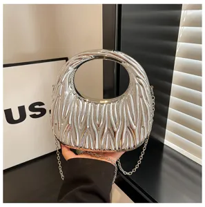 Modern silver metallic pleated handbag featuring a round handle and silver chain strap