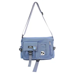 Front view of a blue nylon messenger bag with adjustable strap and multi-pocket design
