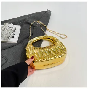 Gold metallic rippled acrylic handbag with elegant gold chain strap