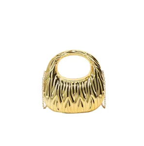 Macro view showing the intricate gold wave-textured pattern on this modern acrylic handbag