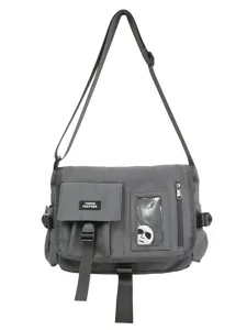 Grey nylon messenger bag with adjustable strap and front flap pocket for students