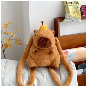 Cute capybara plush backpack with orange decoration displayed in a cozy lifestyle setting