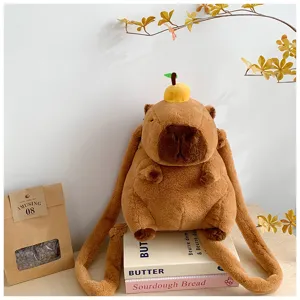 Cute brown capybara plush backpack for kids with a small orange fruit decoration detail