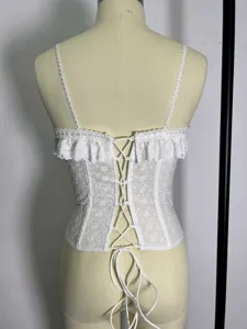 White lace embroidery camisole detail showing back corset lacing and delicate straps.