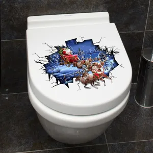 Detail van 3D Kerstman en rendier toiletdekselsticker op een witte toiletzitting