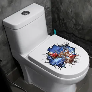 3D-kerst-wc-sticker met kerstman en rendieren aangebracht op een witte toiletbril