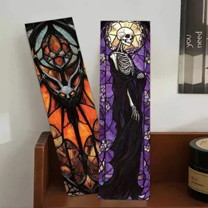 Detailed view of gothic stained glass style bookmarks featuring bat and skeleton art designs