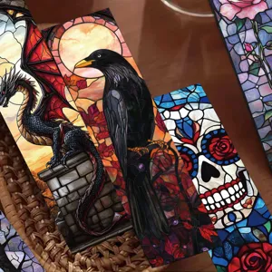 Detailed view of gothic stained glass bookmarks featuring dragon and raven designs