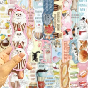 Close-up of a creative cartoon cat cupcake bookmark held by hand for reading decoration