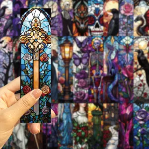 Detailed view of a gothic stained glass bookmark with intricate cross and rose patterns