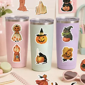 Vintage style Halloween pumpkin and black cat stickers displayed on three colorful tumblers