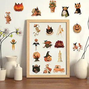 Selection of vintage Halloween pumpkin and character stickers displayed on a frame and wall
