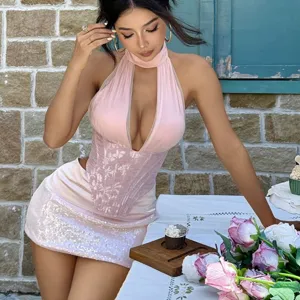 Detail view of the sexy halter neck deep V floral corset top and sequin mini skirt set.