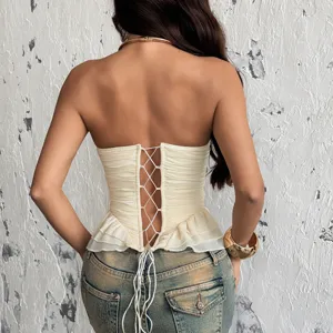 Top corset schiena scoperta con lacci e volant sul fondo, stile sexy ed elegante.