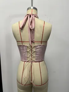 Pink floral halter corset top back view showcasing laced up straps and boned shaping design.