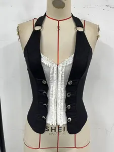 Black and white contrast halter corset top with front buttons and stylish streetwear.
