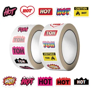 Close-up detail of two rolls of vibrant 'HOT' text stickers for creative DIY scrapbooking