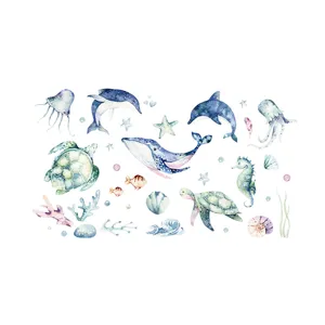 Watercolor ocean animal wall decals with whale, dolphin, and turtle for kids' room decor.
