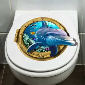 Close-up of 3D dolphin porthole toilet sticker with realistic underwater ocean scene