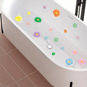 Detailed view of colorful cartoon flower non-slip stickers applied inside a white bathtub.