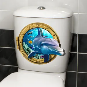 Detailed view of 3D dolphin porthole sticker applied on a white bathroom toilet tank