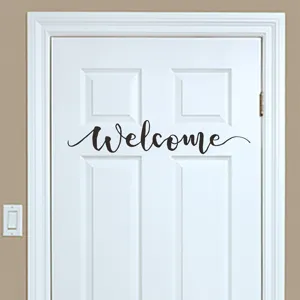 Decorative cursive English 'Welcome' wall decal sticker applied on a white door