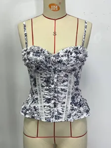 Blue and white floral corset top featuring delicate ruffles, boning structure, and camisole straps.