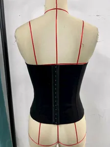 Detailed view of the black strapless corset top highlighting the back closure design.