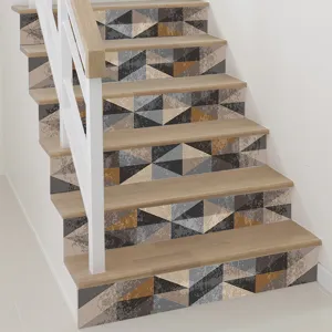 Detail view of 3D geometric pattern self-adhesive stair riser stickers in a modern home