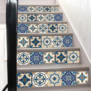 Detailed view of blue and gold geometric tile pattern stickers applied on indoor staircase